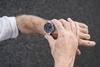 An image showing the hands of an old man looking at his watch