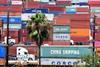 An image showing container trucks at the Port of Long Beach