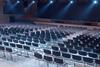 Rows of empty seats in a conference hall