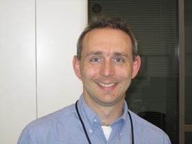 A headshot of Mike Nunn in an office environment