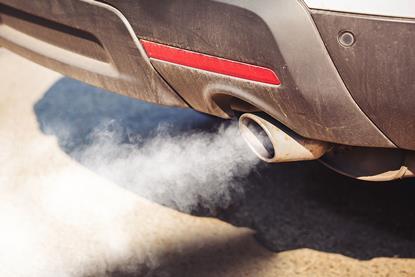 An exhaust pipe emitting smoke